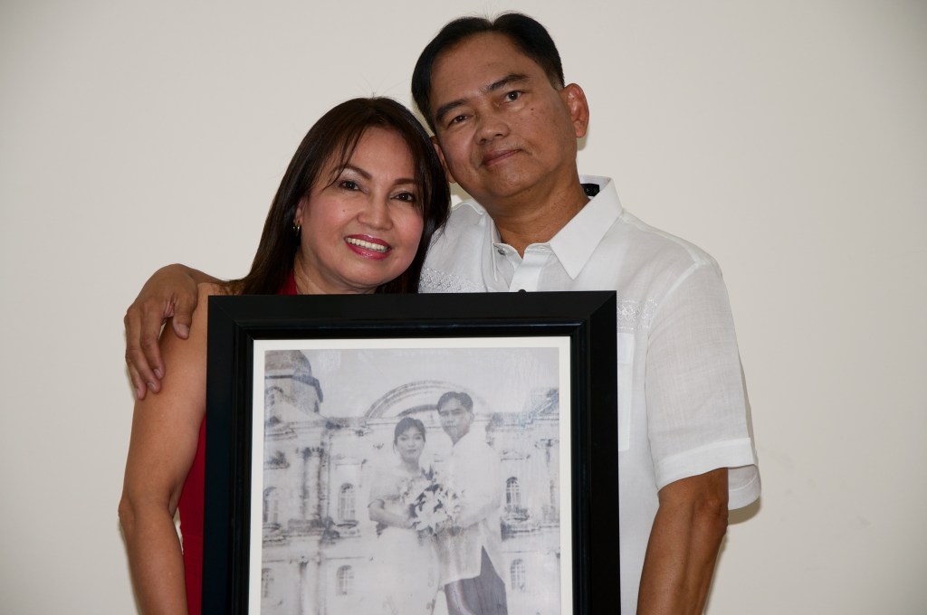 carrying the picture of their renewed vow on 25th year of marriage